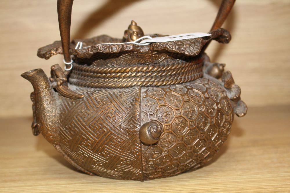 A Chinese iron teapot and cover, height 16cm